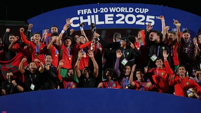 Morocco's captain Houssam Essadak raises the trophy after winning the FIFA U-20 World Cup final. (AP Photo)