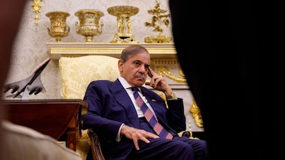 Pakistan PM Shehbaz Sharif looks on as US President Donald Trump speaks to reporters in the Oval Office of the White House before their meeting on September 25. (Image: Andrew Harnik/GETTY IMAGES/AFP)