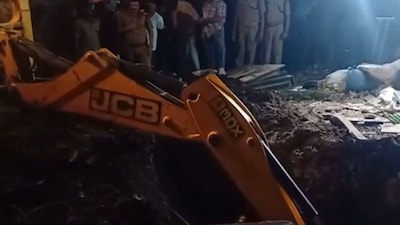 JCB machine being used to recover the bodies. (PTI)
