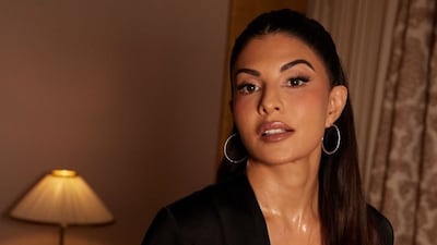 Jacqueline Fernandez in a floor-length black gown with a plunging neckline. (Photo Credit: Instagram)