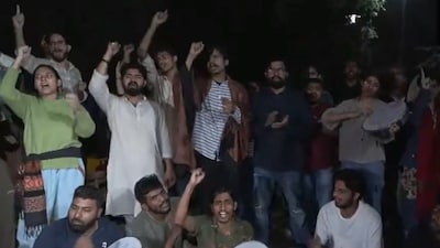 Students stage a demonstration at JNU following a scuffle with the Police. (ANI)