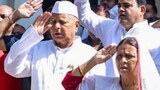 Patna: RJD Chief Lalu Prasad Yadav with party leader Rabri Devi after hoisting the national flag during the 79th Independence Day celebration, in Patna, Friday, Aug. 15, 2025. (PTI Photo)