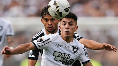 Thiago Almada, front, of Brazil's Botafogo, and Gustavo Scarpa of Brazil's Atletico Mineiro battle for the ball during a Copa Libertadores final soccer match at Monumental stadium in Buenos Aires, Argentina, Saturday, Nov. 30, 2024. (AP Photo/Gustavo Garello, File)

