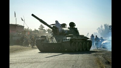 Taliban security personnel on a Soviet-era tank during clashes with Pakistani border forces in the Spin Boldak district of Kandahar province. (AFP)