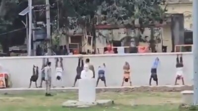 Footage of the incident, recorded by a bystander, shows at least 8 men in handstand positions, their legs resting against a wall. (Screengrab via X)