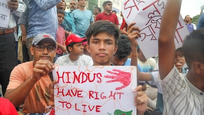 Bangladesh Hindu community members participate in a protest and block the Shahbagh intersection in Dhaka. (PTI file photo)
