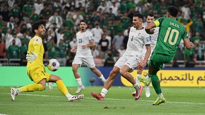 Saudi Arabia's Salem Al Dawsari (right) takes a shot on goal. (AP Photo)
