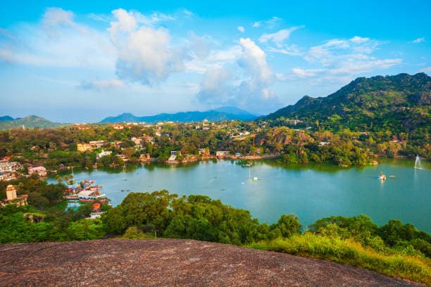 Mount Abu sits in the Sirohi district, surrounded by lush forests, waterfalls, and serene lakes. Its cooler climate makes it a popular retreat from the scorching heat of the plains. The region enjoys pleasant weather year-round, with temperatures ranging from 16°C to 30°C in summer and dipping to 4°C in winter.