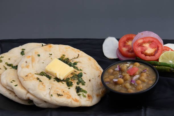 Amritsar: Dive into the richness of Punjabi cuisine with kulchas, butter-laden dal makhani, and the soul-filling Golden Temple langar. Amritsar: Dive into the richness of Punjabi cuisine with kulchas, butter-laden dal makhani, and the soul-filling Golden Temple langar.