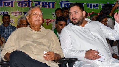 RJD supremo Lalu Prasad Yadav with his son Tejashwi Yadav. (PTI)