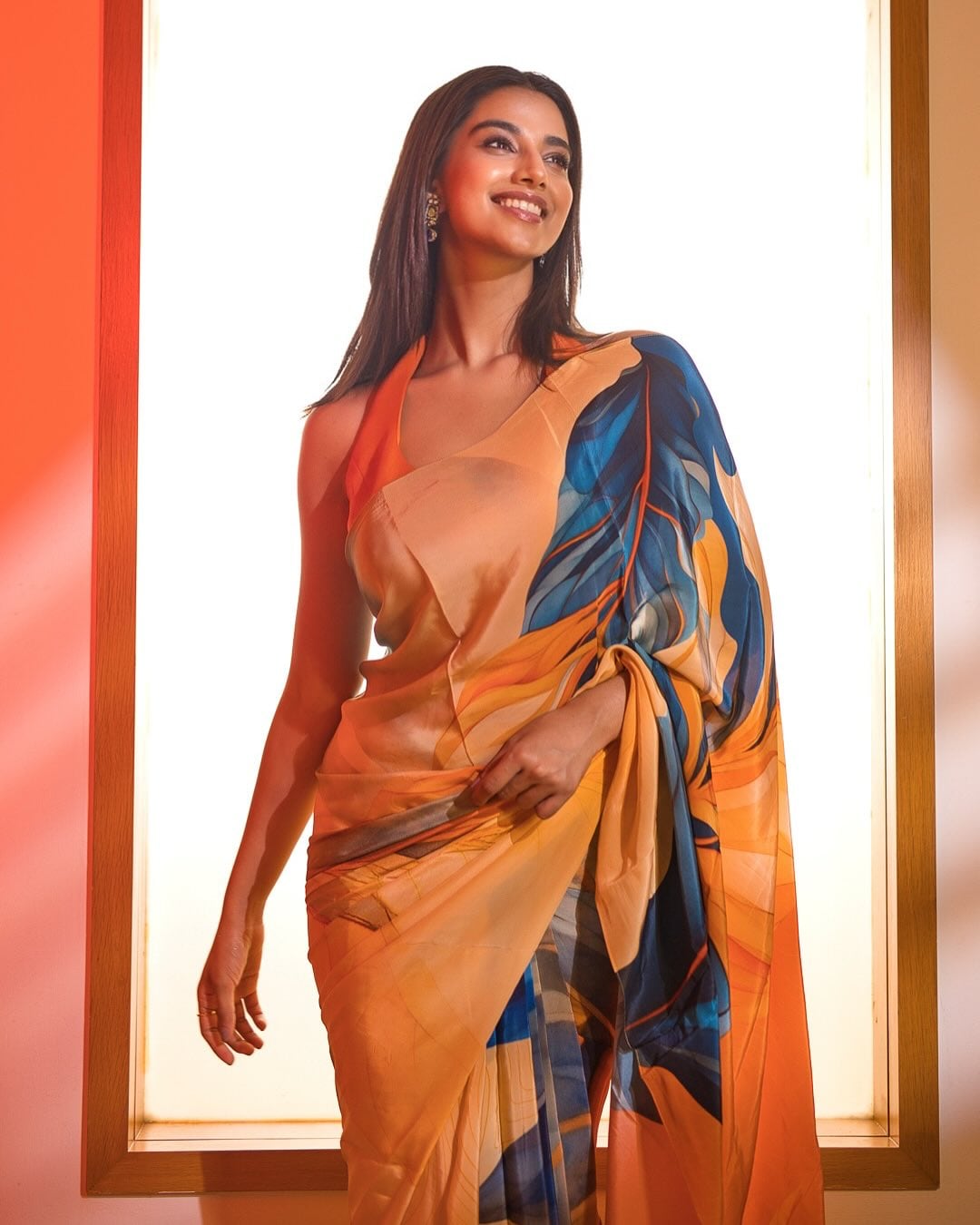 A silk printed saree, just like Meenaakshi Chaudhary, is pure elegance. Wear it with a striking halter-neck blouse. A silk printed saree, just like Meenaakshi Chaudhary, is pure elegance. Wear it with a striking halter-neck blouse.