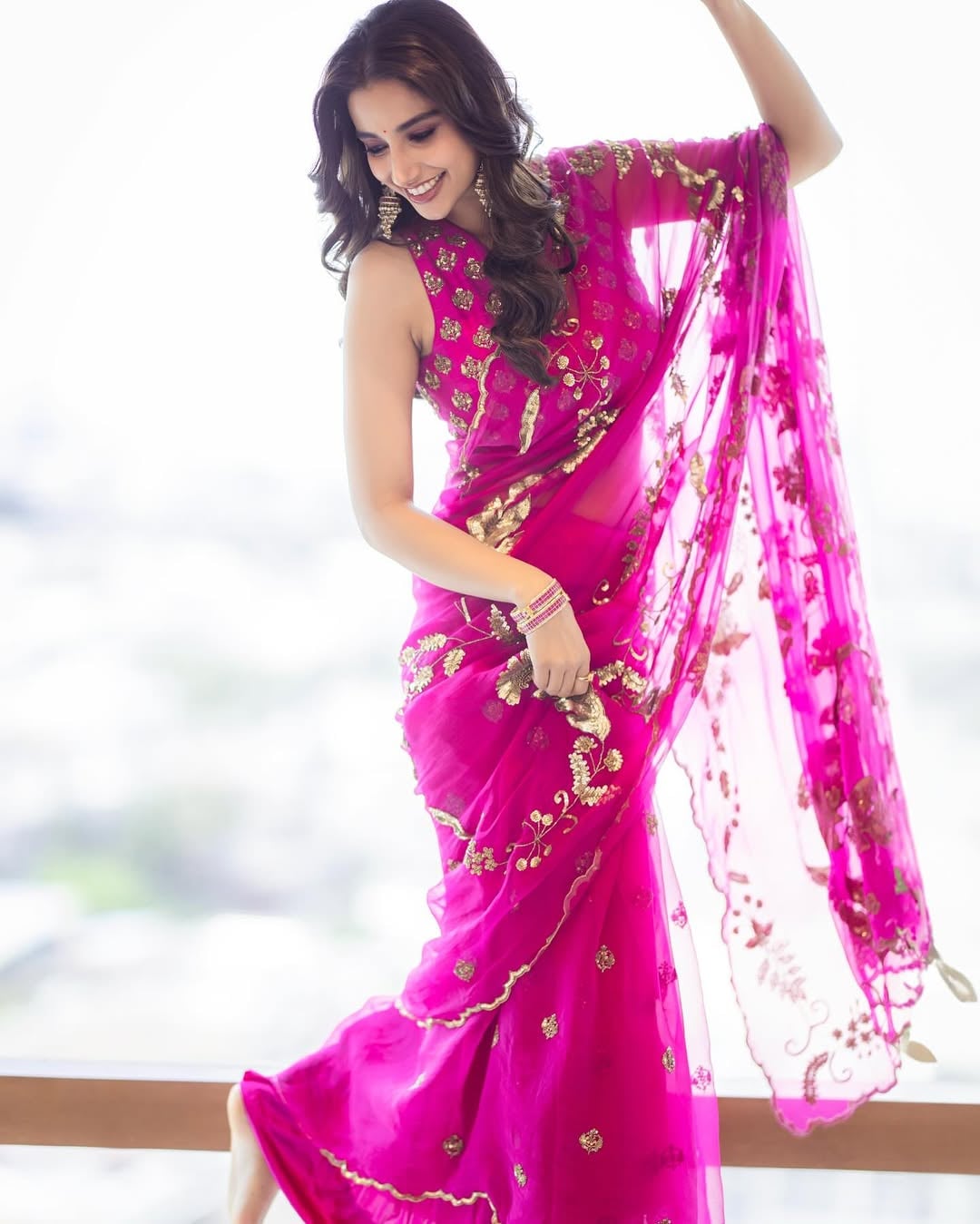 How about a breezy chiffon bright pink chiffon saree with golden embellishments? Definitely a great pick for the festivities! How about a breezy chiffon bright pink chiffon saree with golden embellishments? Definitely a great pick for the festivities!