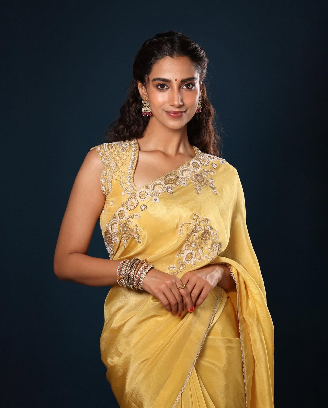 A cheery yellow silk saree with an ornate blouse design is just the apt way to dress up during festivals. A cheery yellow silk saree with an ornate blouse design is just the apt way to dress up during festivals.