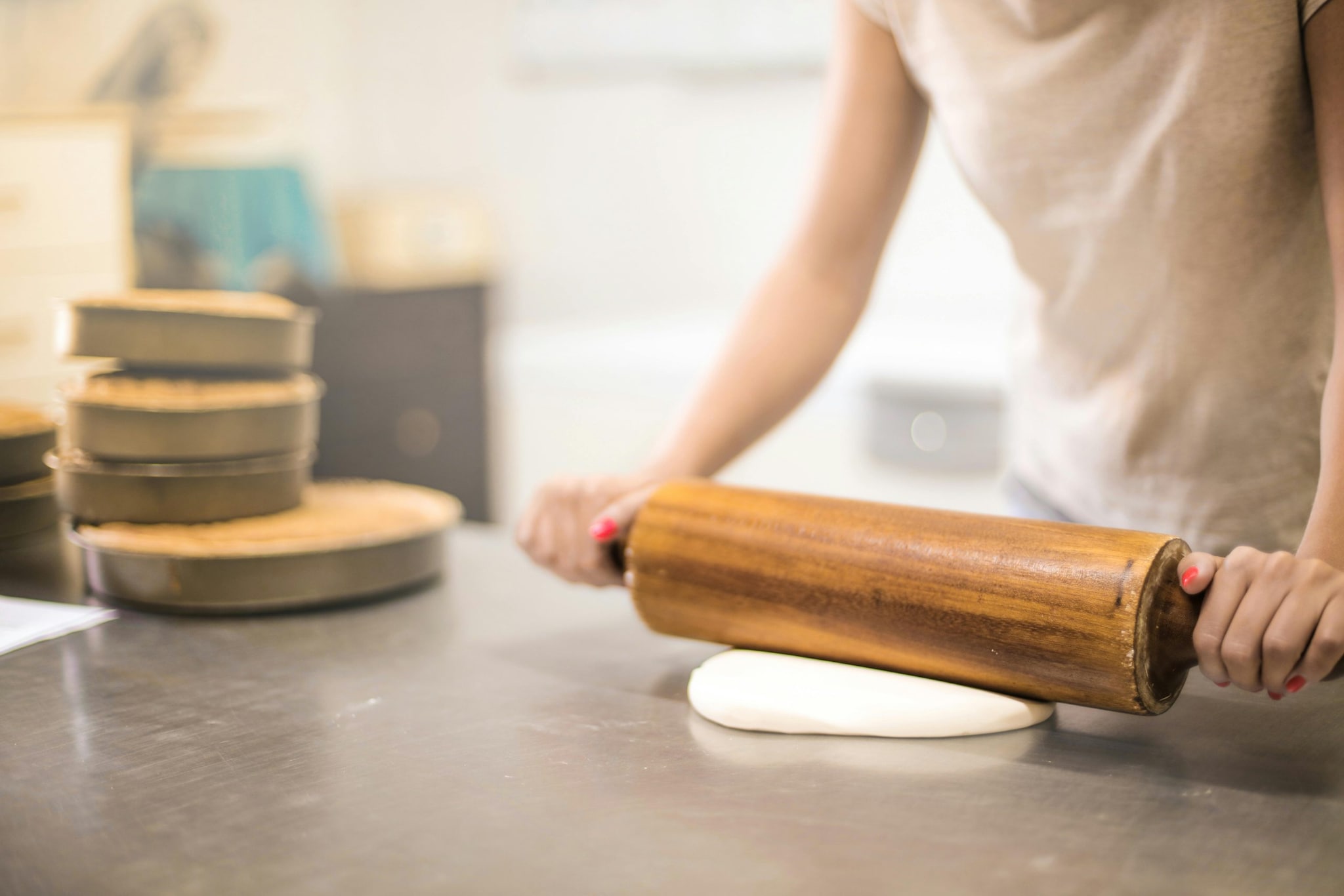 Take small portions of the dough and roll them into thick discs. Take small portions of the dough and roll them into thick discs.