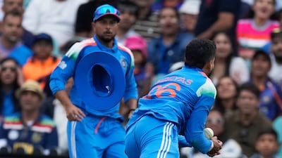Shreyas Iyer (right) takes the catch of Alex Carey in Sydney. (AP Photo)