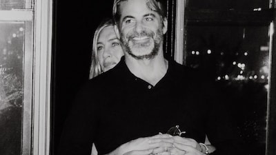 Jennifer Aniston goes Instagram official with boyfriend Jim Curtis, flaunting a diamond band.