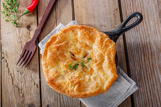 Vegetable Pot Pie: Flaky pastry filled with a creamy medley of root vegetables and peas. Pure comfort food!