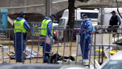 Members of the forensic team work at the scene of a shooting during a Jewish holiday celebration at Bondi Beach, on December 15. (Image: Reuters)