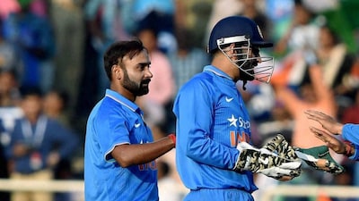 Amit Mishra with Mahendra Singh Dhoni playing for India (PTI)