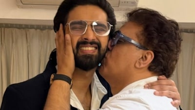 Daboo Malik shares a heartfelt moment with son Amaal Mallik.