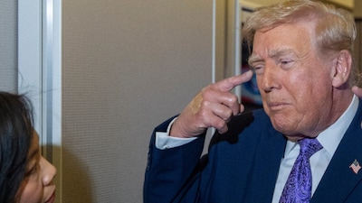 US President Donald Trump speaks with reporters while in flight on Air Force One from his Mar-a-Lago estate in Palm Beach, Florida, to Joint Base Andrews. (IMAGE: AP PHOTO) 