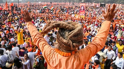 People take part in the 'five-lakh-voices Gita chanting' event, at the Brigade Parade Ground, in Kolkata. (PTI)