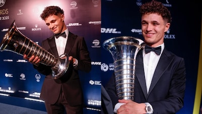 Lando Norris with his F1 World Championship Trophy (X)