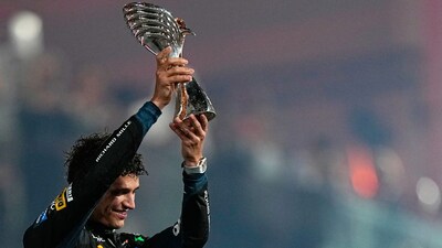 Lando Norris with his maiden F1 title (AP)