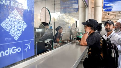 Mumbai: Passengers at an IndiGo airlines counter amid flight disruptions (Photo: PTI)