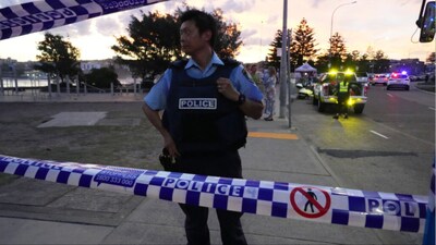 Police cordon off an area at Bondi Beach after a reported shooting in Sydney (Photo: AP)