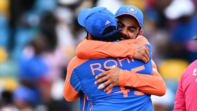 Rohit Sharma and Virat Kohli share an emotional hug in Barbados.(AFP Photo)