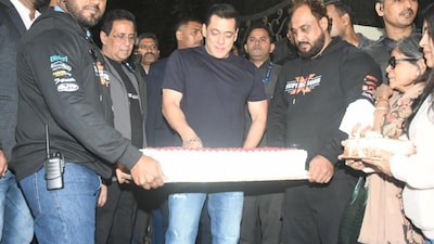 Salman Khan cuts his birthday cake with paparazzi outside his Panvel farmhouse as he turns 60.