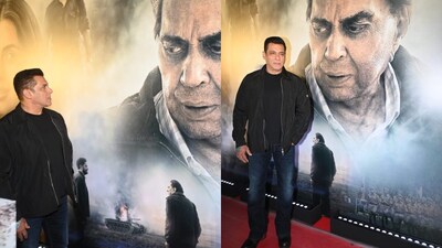 Salman Khan turns emotional while posing beside Dharmendra’s poster at the Ikkis screening in Mumbai.