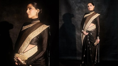 Sonam Kapoor stuns in a black saree, flaunting her baby bump at a Mumbai event. (Photos: Viral Bhayani)