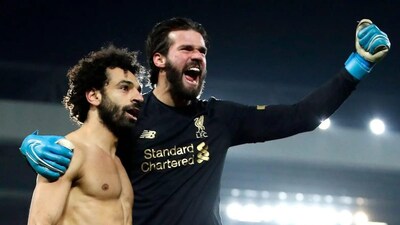 Mohamed Salah, Alisson Becker. (X) 