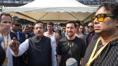 Lionel Messi with compatriot footballer Rodrigo De Paul, back center, West Bengal Sports Minister Aroop Biswas, front second left, organiser Satadru Datta, right (Picture credit: PTI)