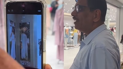 The mother took out her phone to capture a photo of the billboard. (Photo Credit: Instagram)