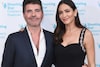 Simon Cowell with his girlfriend Lauren Silverman (Photo Credit: X)