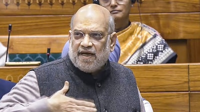 Union Home Minister Amit Shah speaks in the Lok Sabha during the winter session of Parliament, in New Delhi on December 10, 2025. (Image: Sansad TV/PTI)