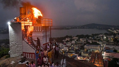 A lamp lit at Thiruparankundram temple as part of 'Karthigai Deepam' festival celebrations, in Tamil Nadu's Madurai district on December 3, 2025. (Image: PTI)