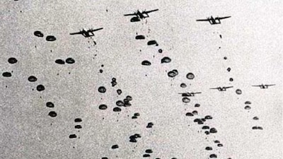 Despite wind drift and scattered landings, between 700 and 800 paratroopers were on the ground by late afternoon.