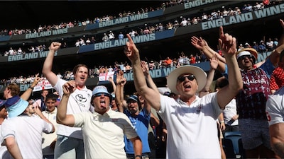 Fans celebrate England's victory over Australia on Day 2 of their Ashes Test in Melbourne (Picture credit: AP)