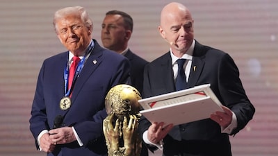 President Donald Trump receives the FIFA Peace Prize from FIFA President Gianni Infantino during the draw for the 2026 soccer World Cup at the Kennedy Center in Washington, Friday, Dec. 5, 2025. (AP Photo/Jacquelyn Martin)