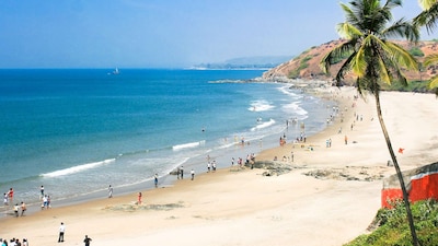 Goa offers lively nightlife, beach shacks, and water sports.