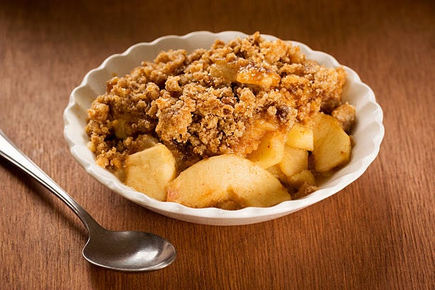 Stir the raisins into the cooked apples and sprinkle the crumble mixture all over the top. 