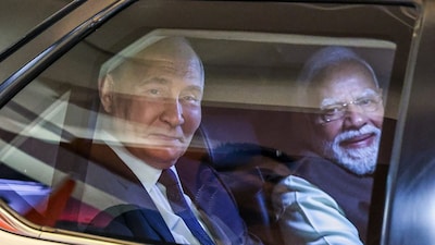 Russian President Vladimir Putin (left) and Indian PM Narendra Modi in the white Toyota Fortuner. (AP)