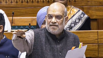 Union Home Minister Amit Shah speaks in the Lok Sabha during the Winter session of Parliament, in New Delhi, on Wednesday. (Sansad TV via PTI)