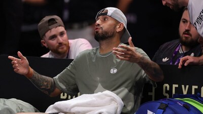Nick Kyrgios reacts during a changeover during his Battle of the Sexes match against Aryna Sabalenka. (AP Photo)