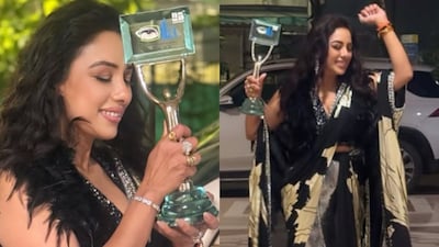 Rupali celebrates with her award.