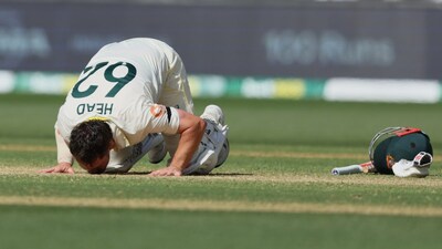 Travis Head kisses the turf after scoring 11th century of his Test career. (AP Photo) 